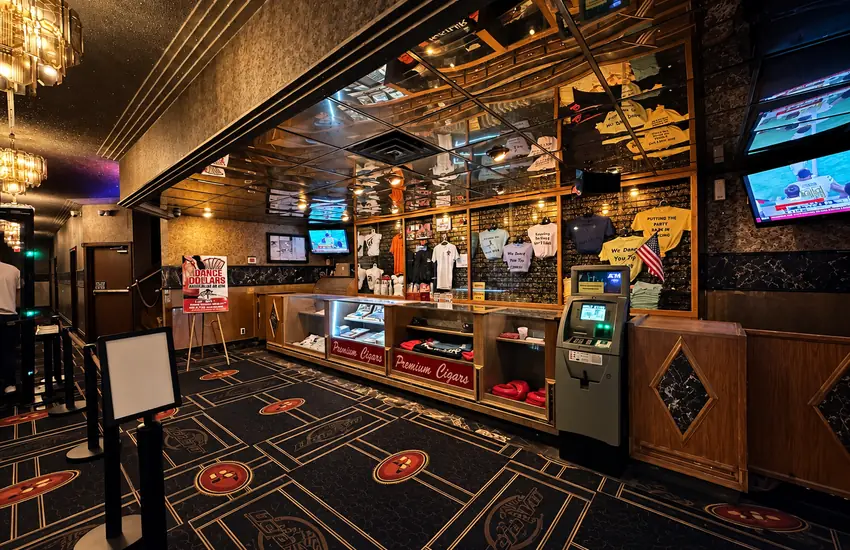 Entrance lobby — merch counter, premium cigars case, and ATM