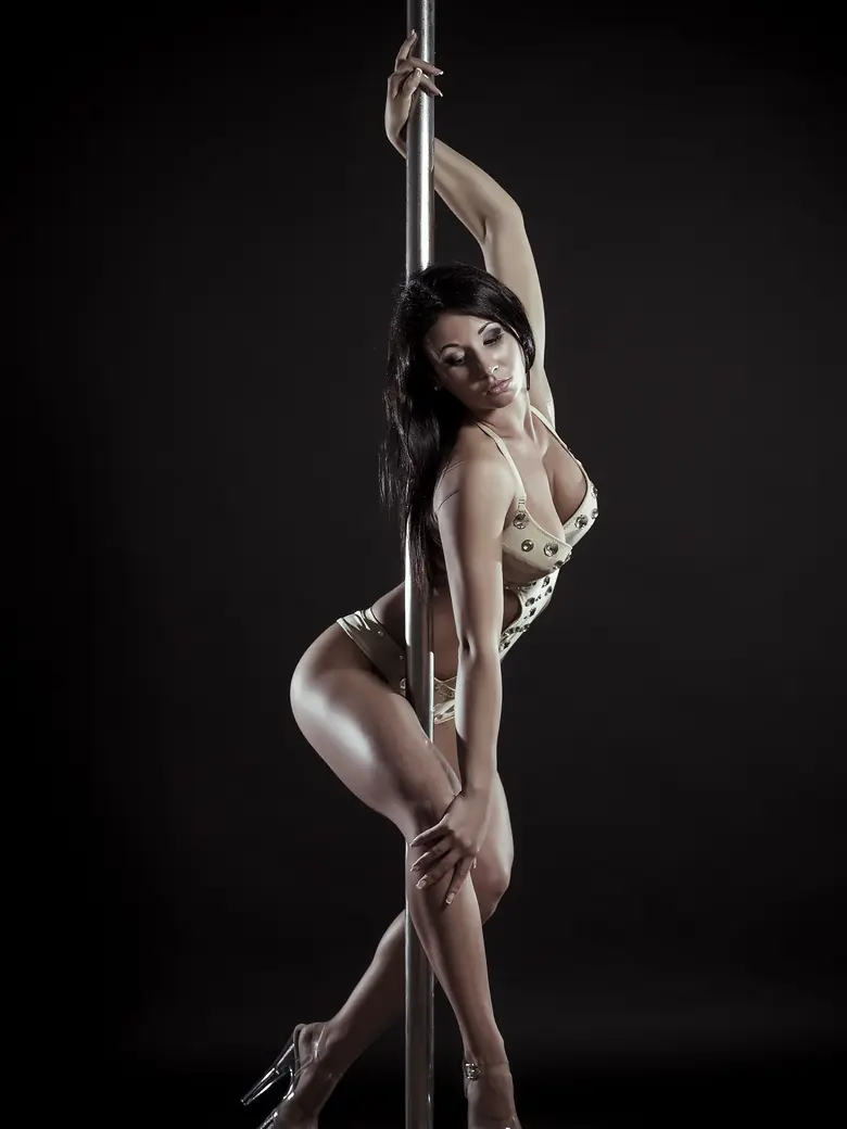 Showgirl wrapped at the pole — late-night North Loop destination