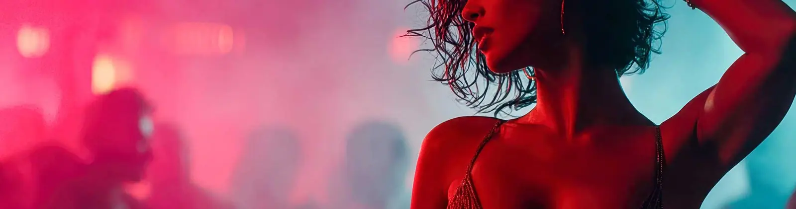 Showgirl in red and teal stage light