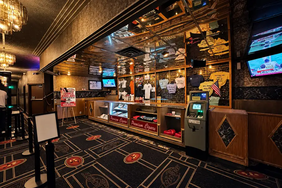 Lobby, merch counter, and premium cigars case at Déjà Vu Minneapolis
