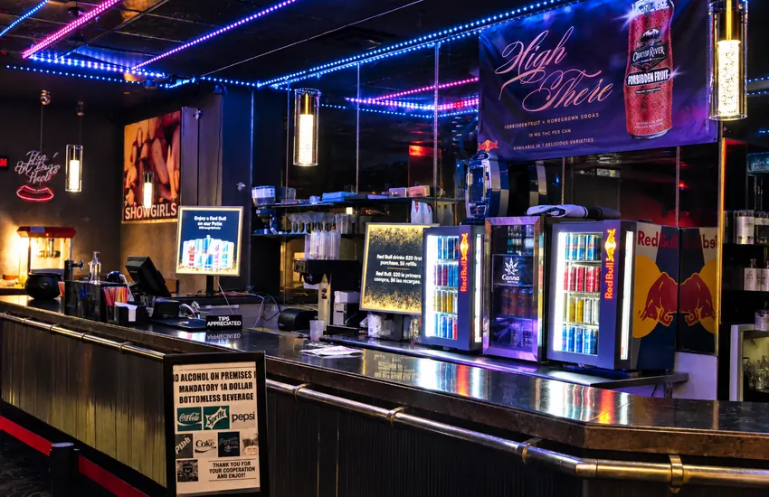 The juice bar — sodas, energy drinks, and THC beverages under the neon