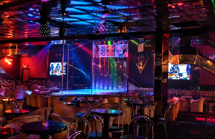Stage and seating under the mirrored ceiling and disco ball
