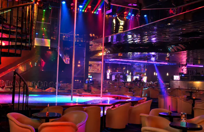 Wide view of the main room — stages, bar, and light show